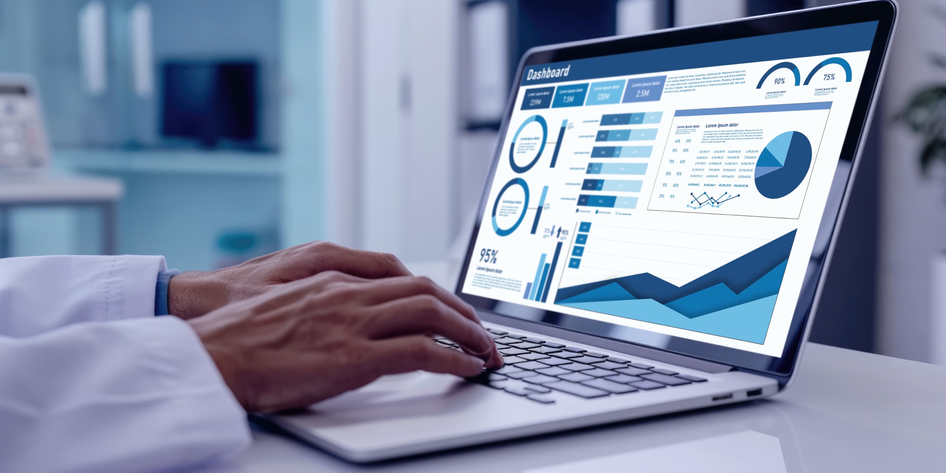 Healthcare professional analyzing a data dashboard on a laptop